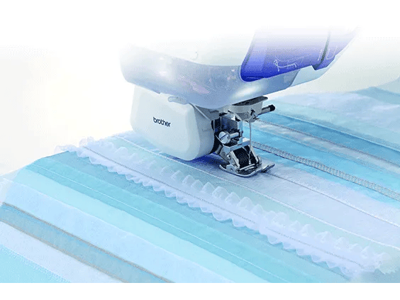 Brother sewing machine presser foot stitching decorative scalloped edge on blue striped fabric