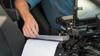 Brother PocketJet portable printer printing document in law enforcement vehicle