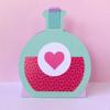 Turquoise paper craft bottle with pink heart design on pastel background