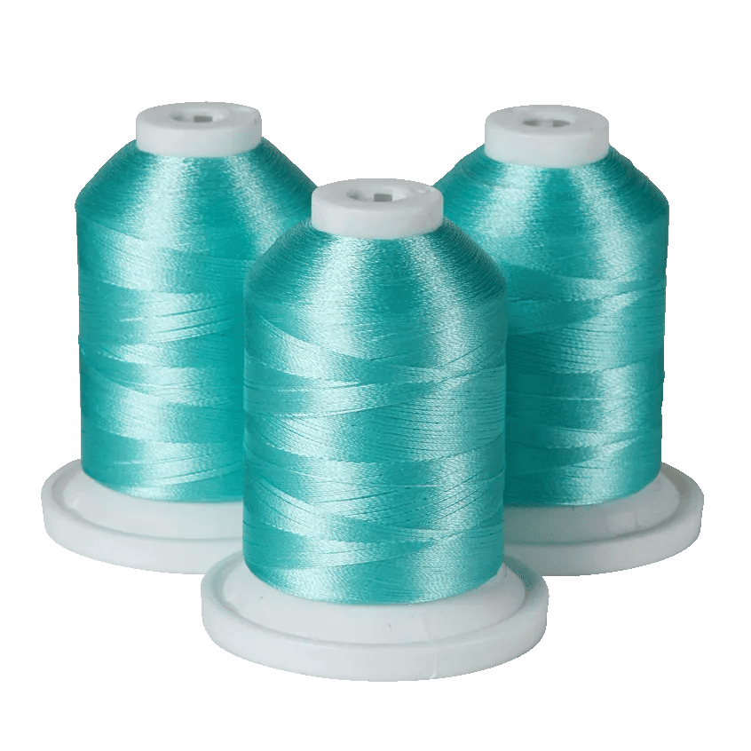 Three turquoise embroidery thread spools on white bases for Brother sewing machines