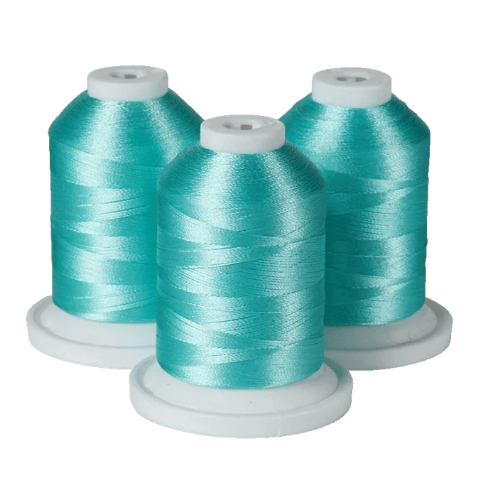 Three turquoise embroidery thread spools on white bases for Brother sewing machines
