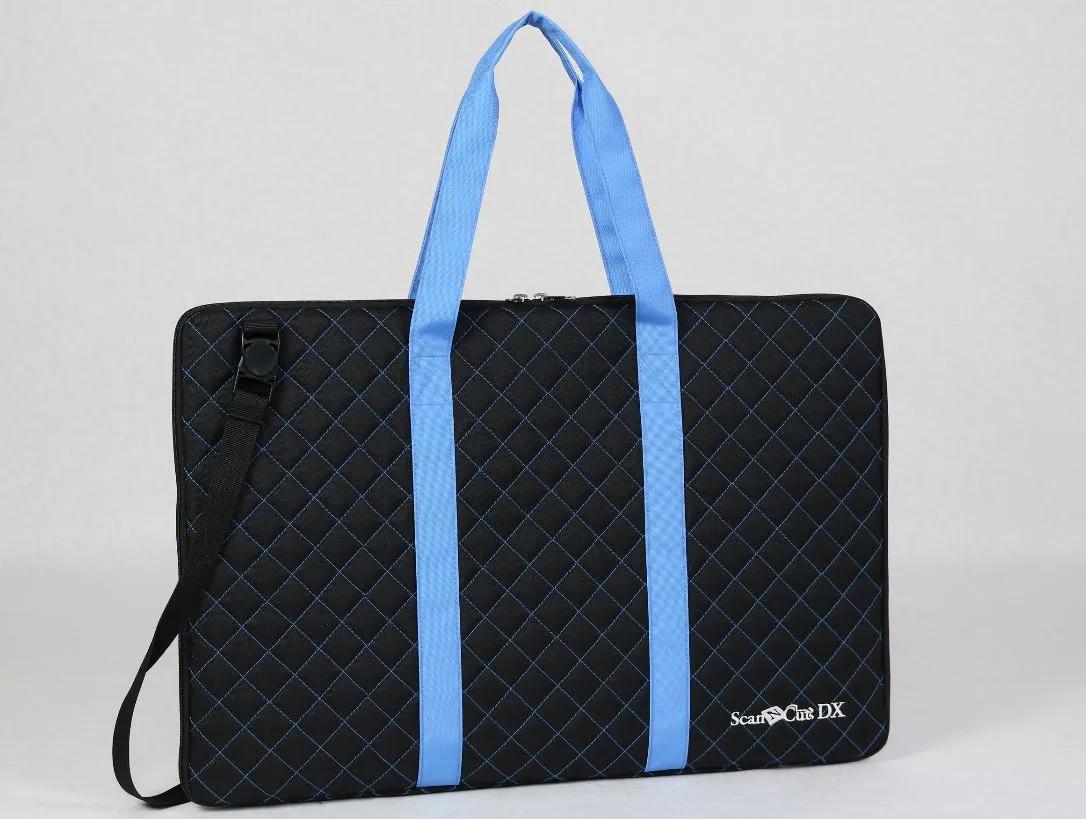 Brother ScanNCut DX portable cutting machine in quilted black carrying case with blue handles