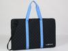 Brother ScanNCut DX portable cutting machine in quilted black carrying case with blue handles