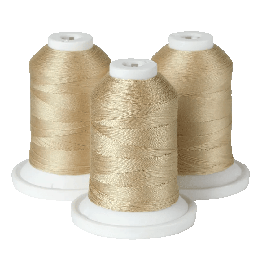 Three spools of gold embroidery thread on white bases for Brother sewing machines