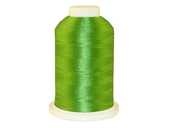 Brother embroidery thread spool in vibrant green with white cap on base