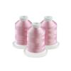 Three spools of pink embroidery thread on white bases