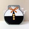 Round gift box with orange ribbon bow and white tissue paper