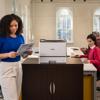 Brother HL-L8430CDW color laser printer in modern office with professionals working