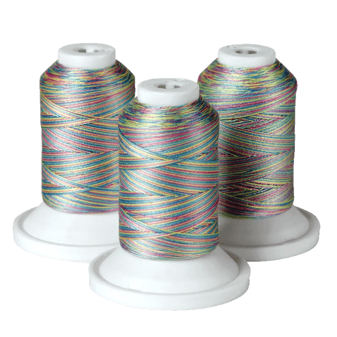Three spools of multicolored embroidery thread on white bases
