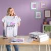 Woman displaying custom sublimation-printed t-shirt with Brother wireless printer on desk