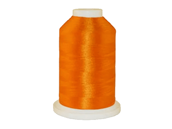 Brother orange embroidery thread spool on white background