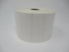 Roll of white die-cut shipping labels on cardboard core