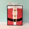 Decorative gift box with Santa Claus suit design featuring red patterned paper and black belt
