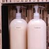 Brother TZe label on shampoo and conditioner bottles in bathroom organizer