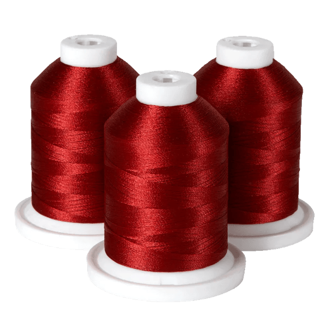 Three spools of red embroidery thread on white bases for Brother sewing machines