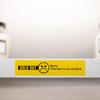 Yellow sold-out label on white retail shelf with sad face icon indicating item unavailable