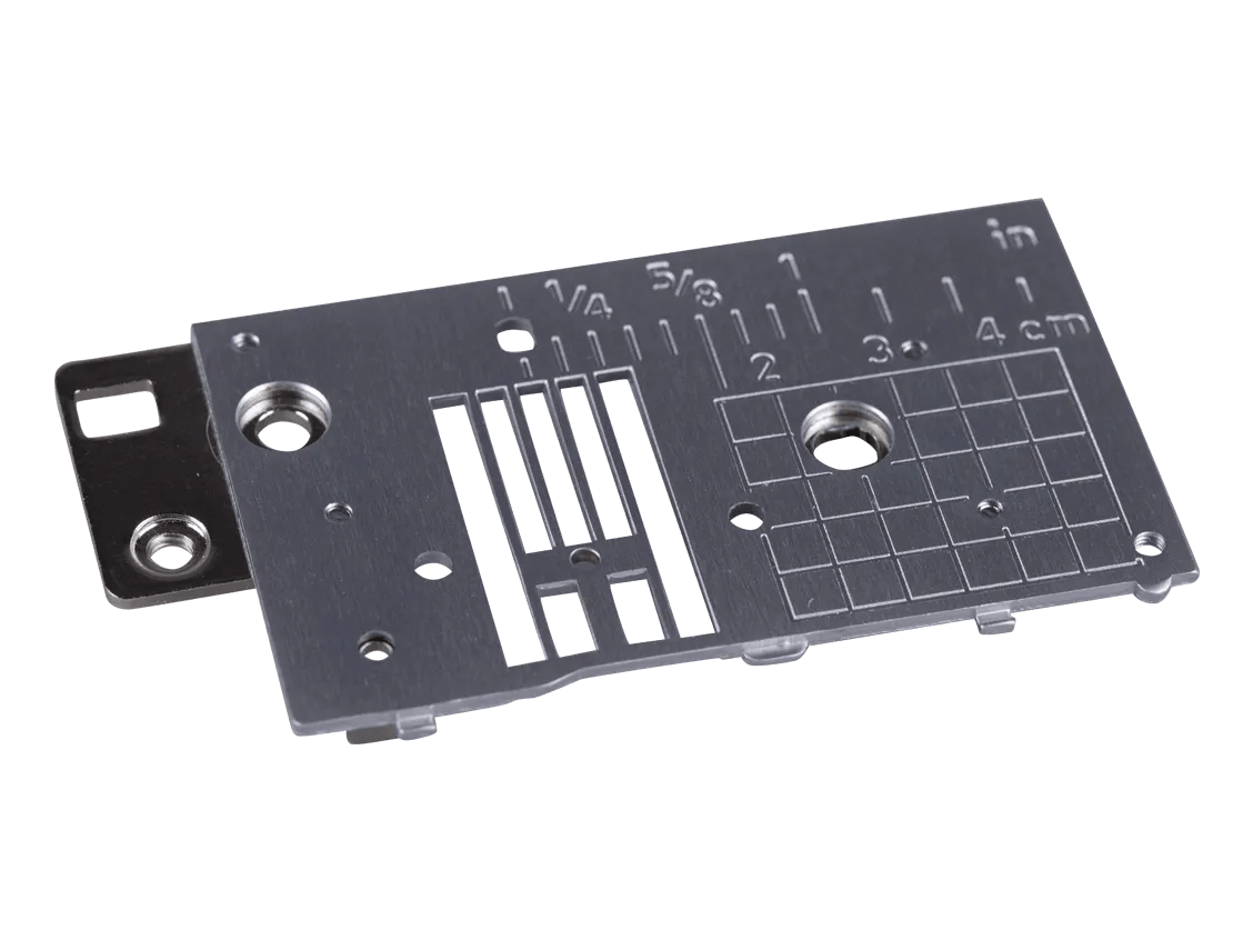 Brother sewing machine needle plate with measurement markings and stitch slots