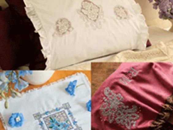 Embroidered pillowcases and fabric with decorative floral and butterfly stitching patterns