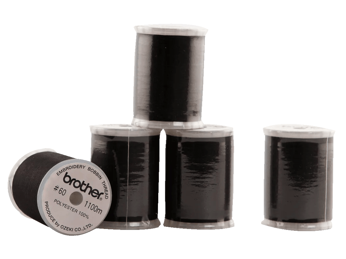 Brother black polyester embroidery bobbin thread spools on white background