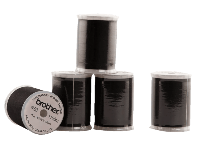 Brother black polyester embroidery bobbin thread spools on white background