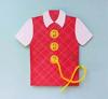 Red quilted vest with white collar and yellow buttons, displayed with scissors