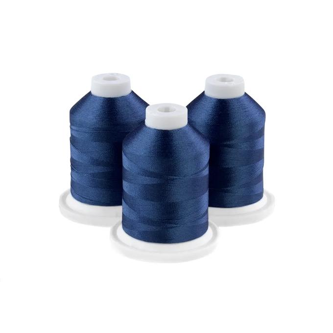 Three navy blue embroidery thread spools on white bases