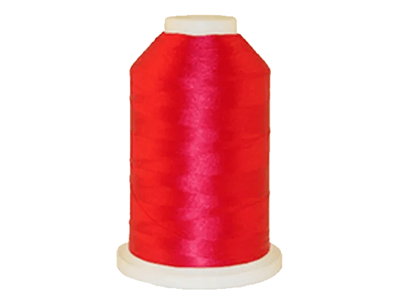 Red embroidery thread spool on white background