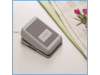 Brother foot pedal for sewing machine on white desk with fabric and flowers