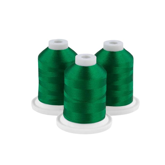 Three dark green embroidery thread spools on white bases