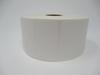 Roll of white die-cut labels with rounded corners on cardboard core