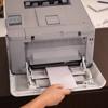 Brother HL-L8570CDW color laser printer with open paper tray and hand loading paper