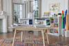 Two Brother Celeste sewing and quilting machines with touchscreens on table in bright craft room