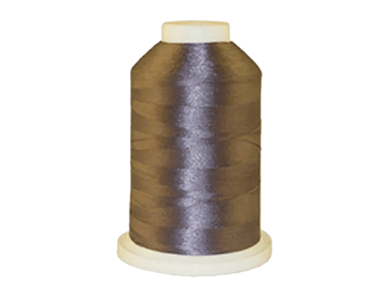 Brother embroidery thread spool in dark brown with beige cap on white base