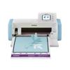 Brother ScanNCut DX cutting machine with touchscreen cutting floral design on blue mat