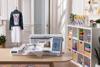 Brother Stellaire embroidery machine with touchscreen on craft table in bright sewing room