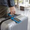 Brother TZe-354 laminated label on silver suitcase handle for travel identification