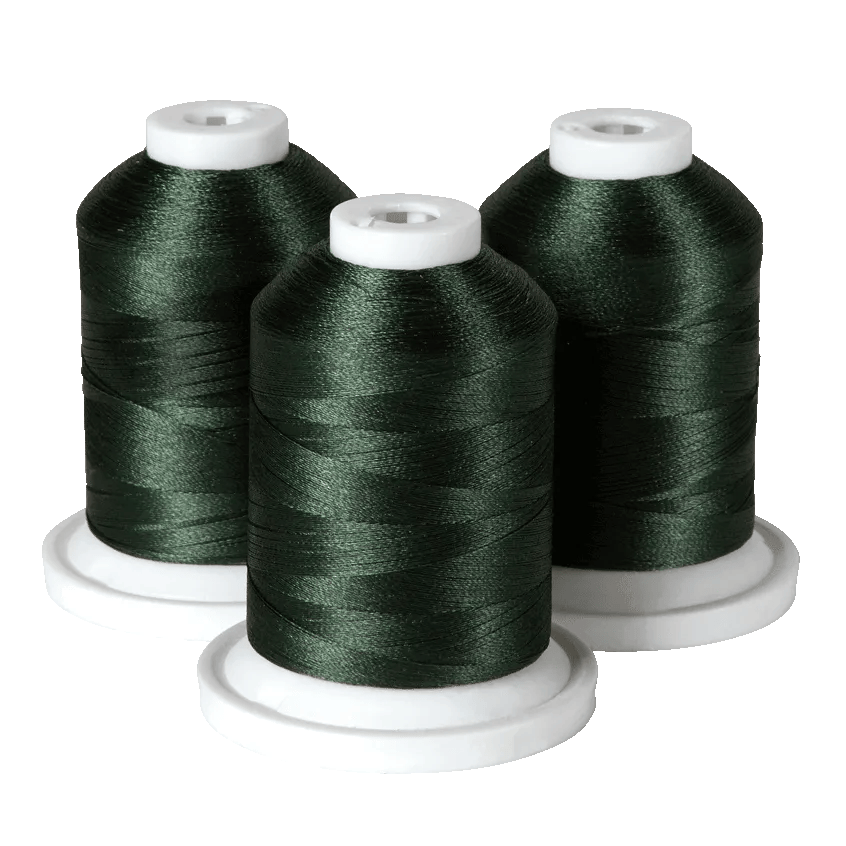 Three dark green embroidery thread spools on white bases