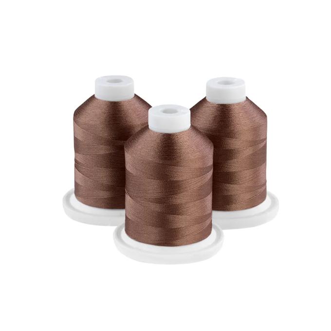 Three brown embroidery thread spools on white bases