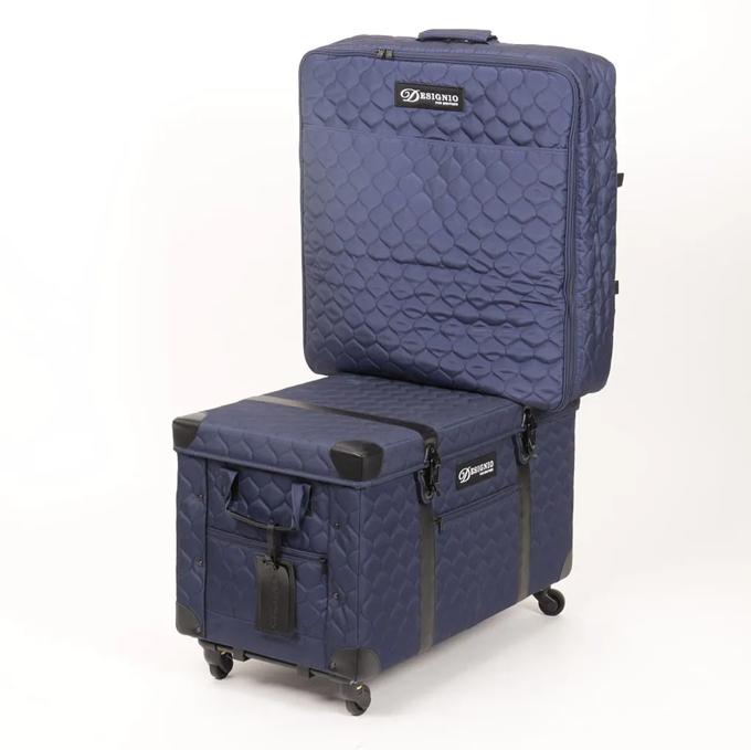 Navy quilted rolling sewing machine case with wheels and padded interior compartments
