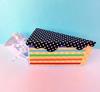 Brother ScanNCut fabric catcher bin with colorful striped design and polka dot lid
