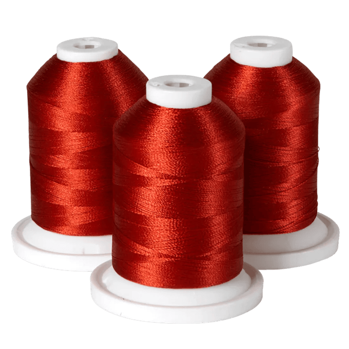 Three spools of red embroidery thread on white bases for Brother sewing machines
