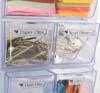 Organized clear storage drawers with labeled compartments for office supplies and colorful sticky notes
