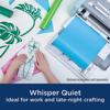 Brother cutting machine with hands crafting vinyl designs on cutting mat