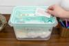Organized first aid kit with labeled compartments for bandages, allergy relief, and eye drops