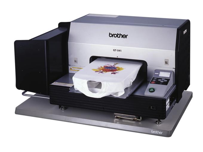 Brother GT-541 garment printer printing colorful floral design on white t-shirt