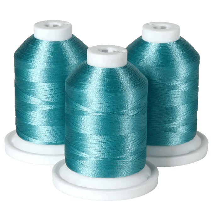 Three turquoise embroidery thread spools on white bases for Brother sewing machines