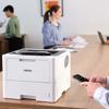 Brother HL-L6210DW monochrome laser printer on office desk with mobile printing capability