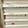 Brother TZe label tape organizing office files in labeled trays for incoming and outgoing documents