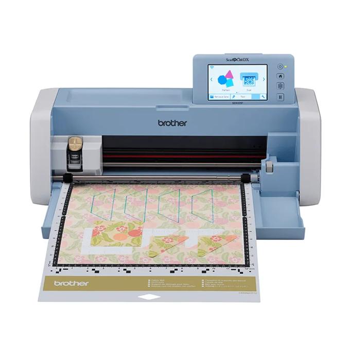 Brother SDX225F cutting machine with touchscreen display cutting floral pattern on mat