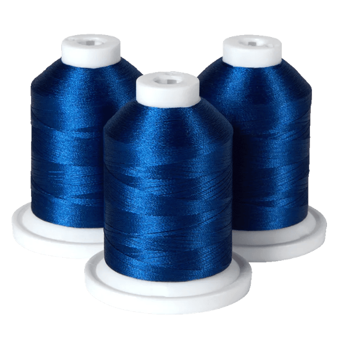 Three spools of blue embroidery thread on white bases for Brother sewing machines